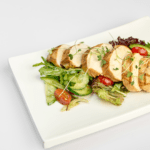 Куриное филе на овощной подушке с соусом песто